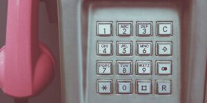 An image of a pink phone with push buttons